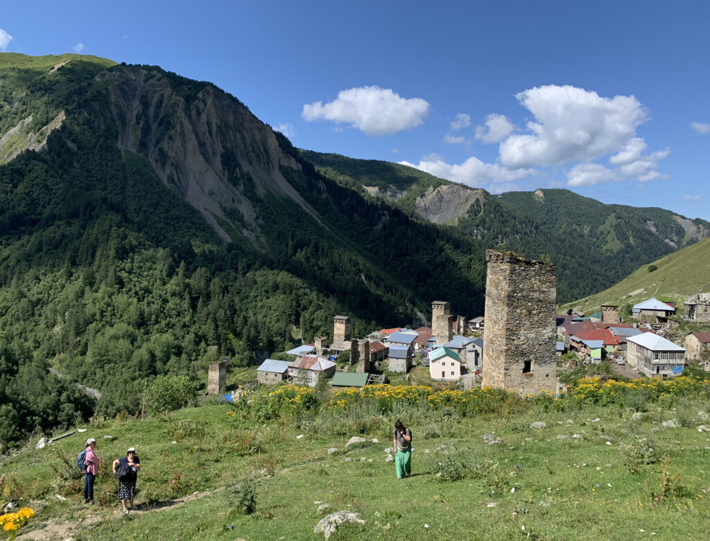 there is a group of people that are walking up a hill