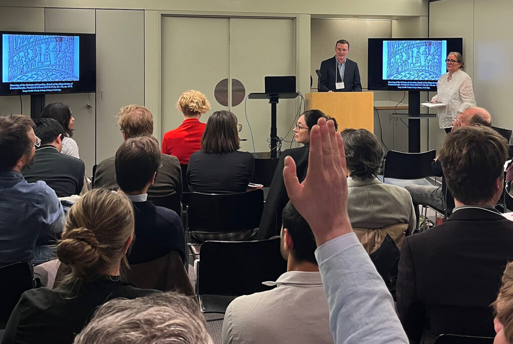 there is a man giving a presentation to a group of people