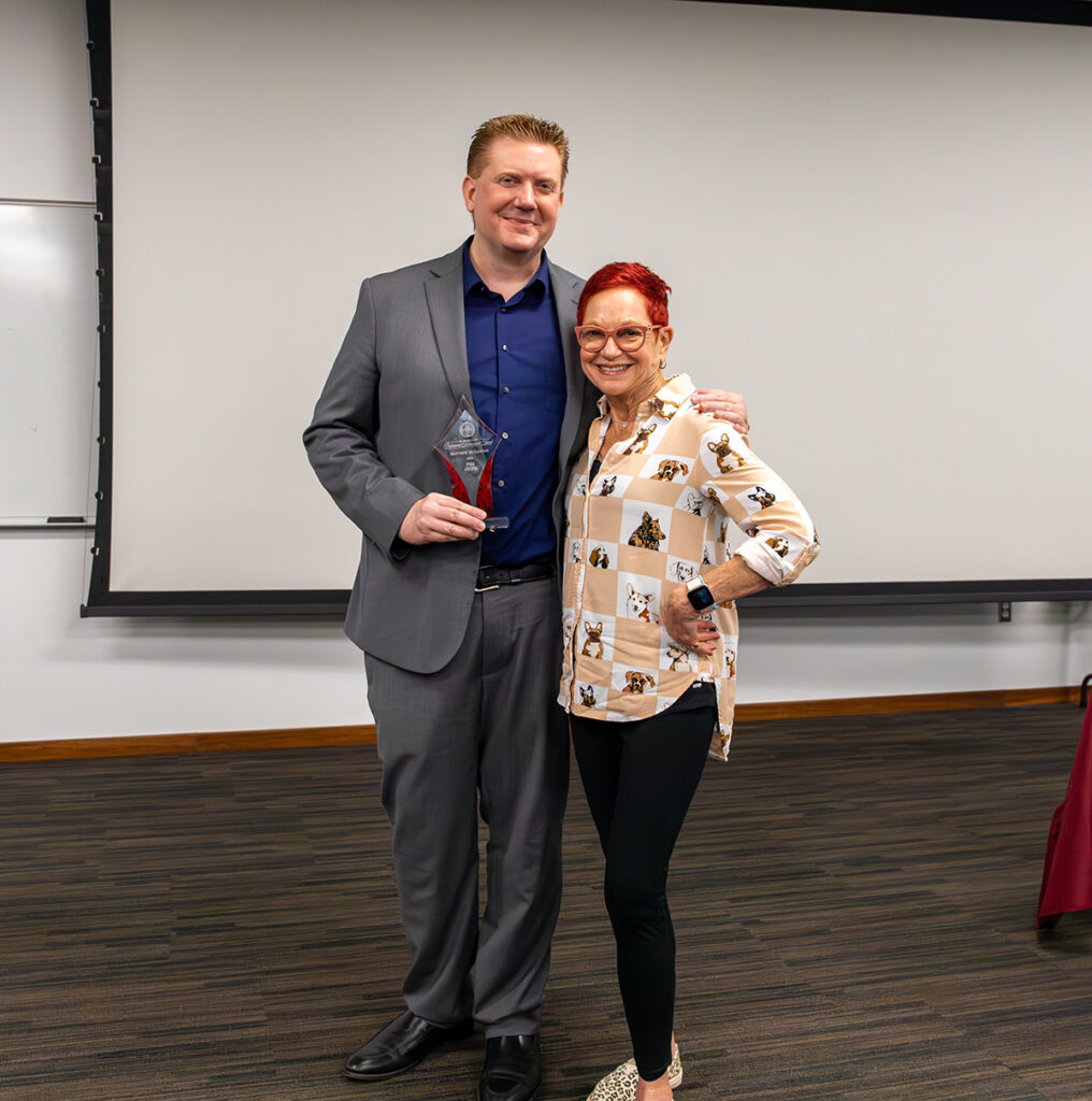 Honoree Matt McLendon with Professor Lauren Weingarden (ret.)