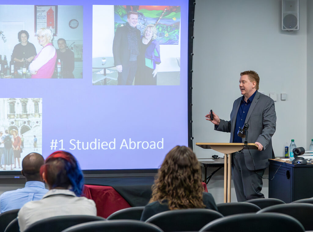 Matthew McLendon presenting at Alumni Awards ceremony