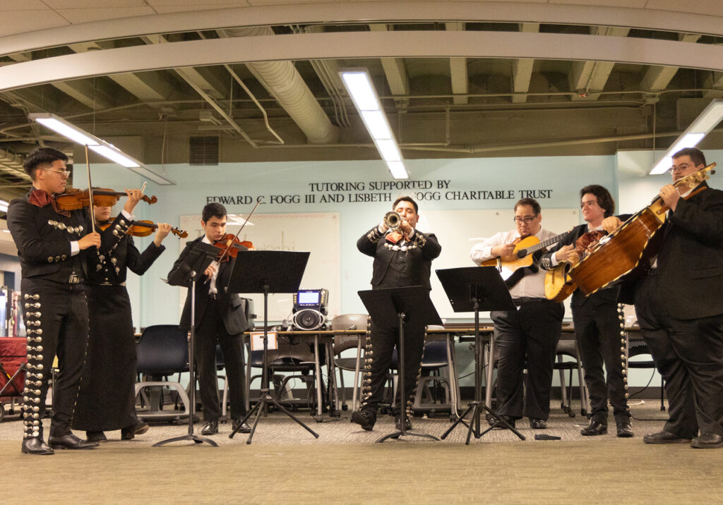 there is a group of people that are playing instruments in a room
