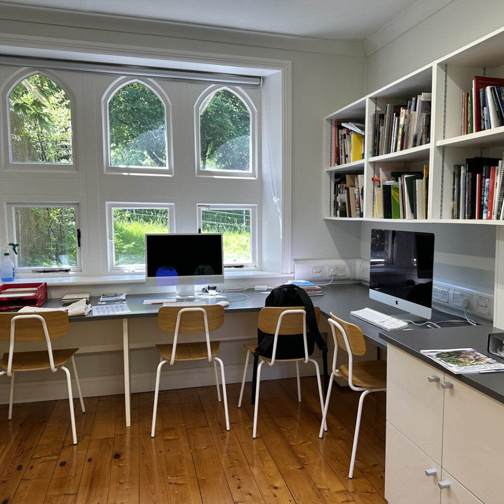 this is an image of a home office with a desk and a computer