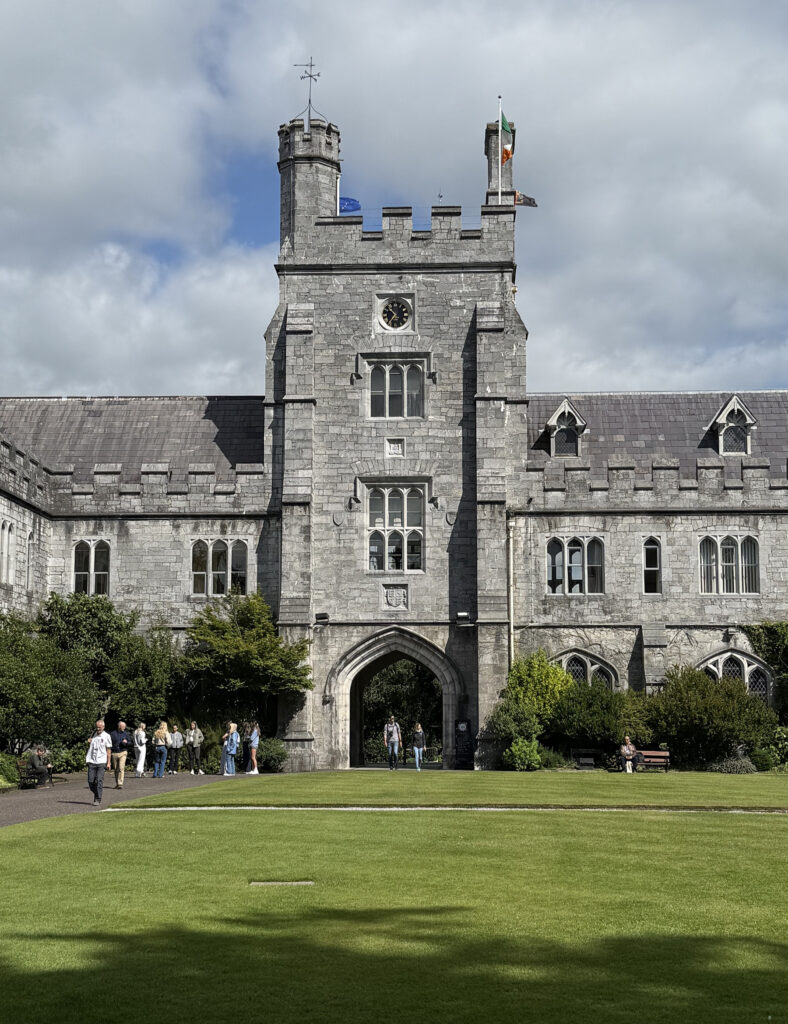 there is a large stone building with a clock tower on top of it