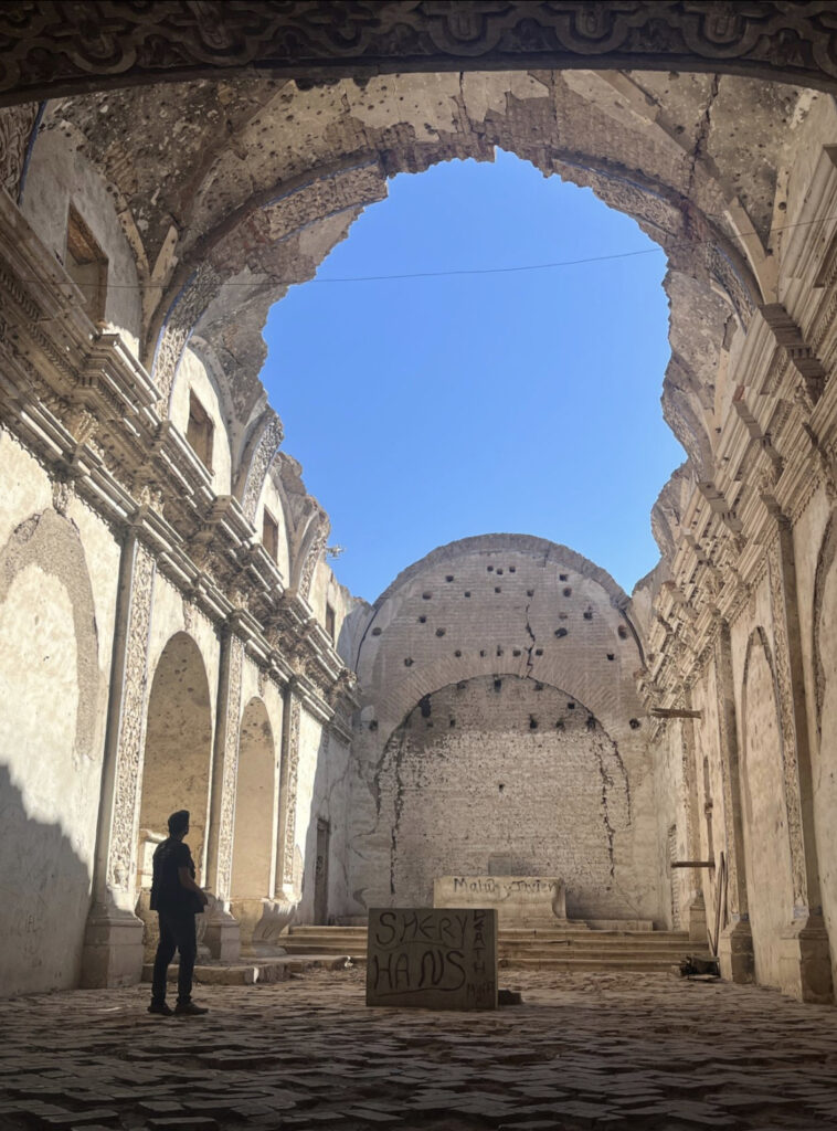 there is a man that is standing in the middle of a building