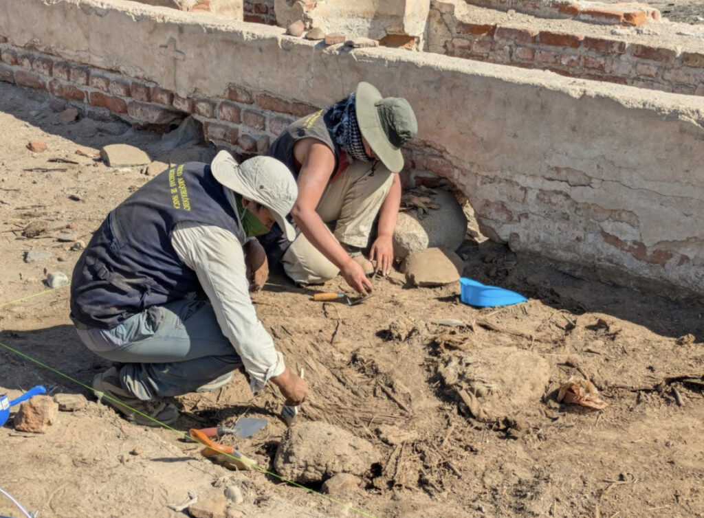there are two people that are digging in the dirt