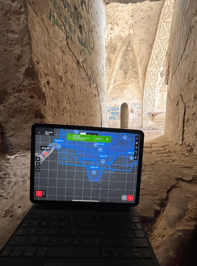 there is a laptop computer sitting on top of a table in a tunnel
