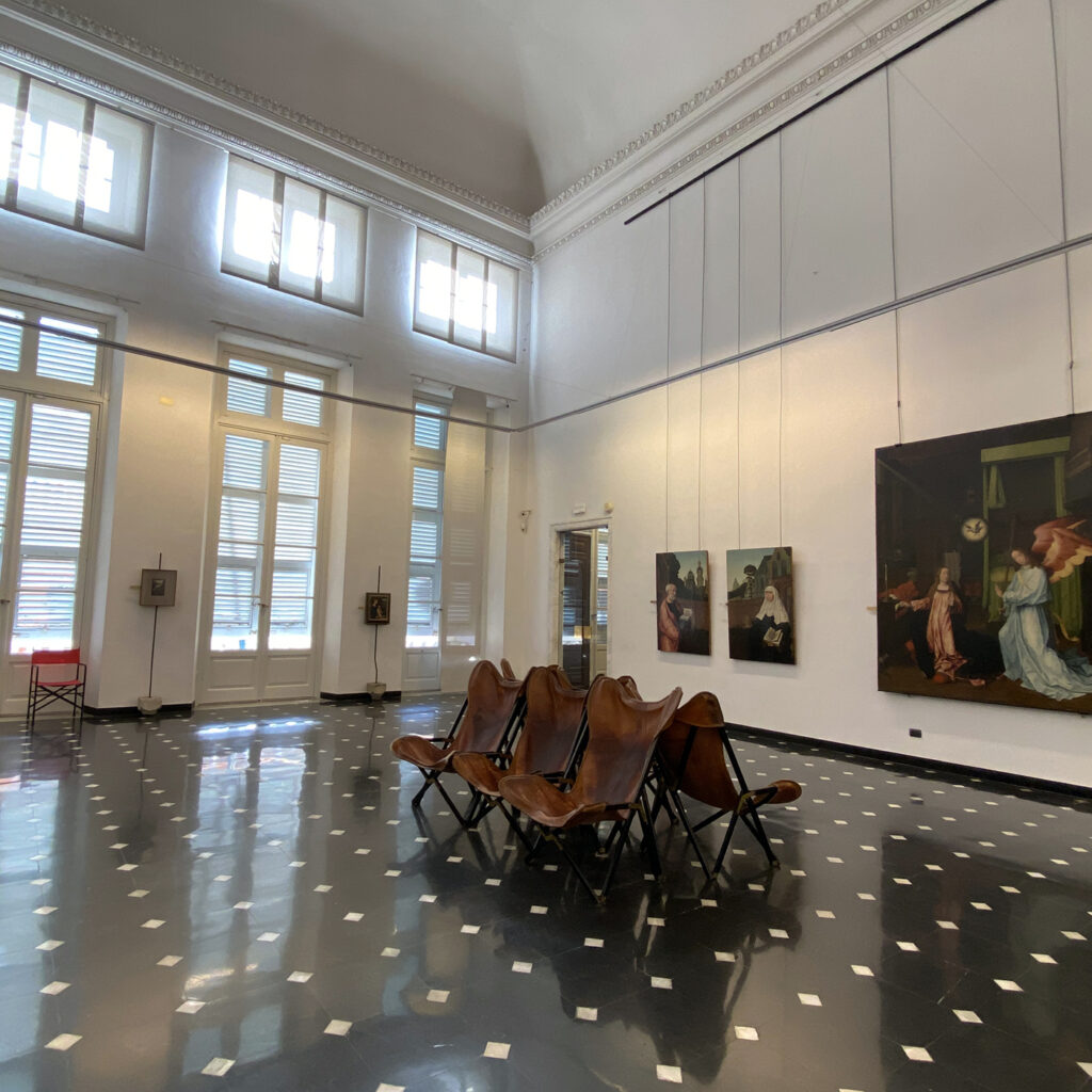 there is a large room with a lot of paintings on the walls