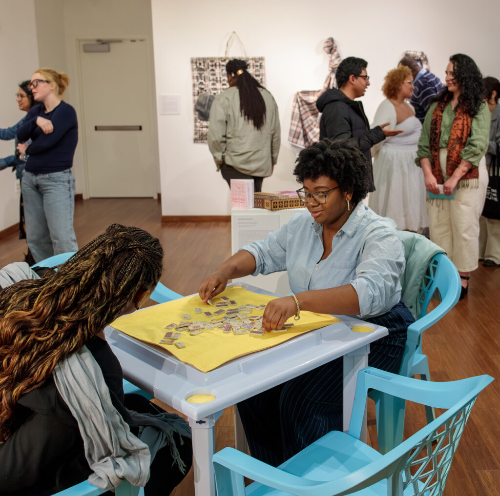 there is a woman that is sitting at a table with a book