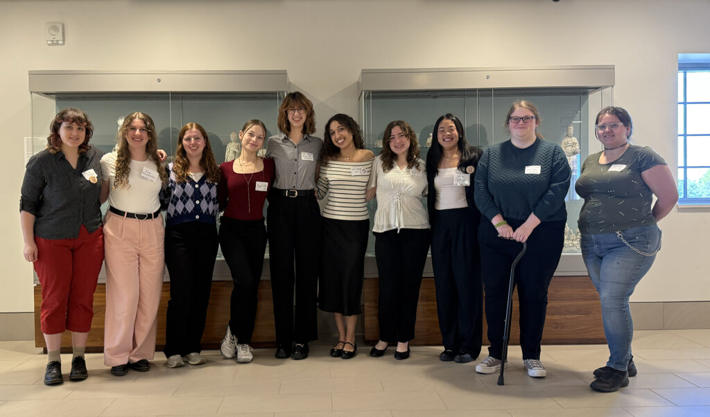 there are a group of women that are standing together in a room