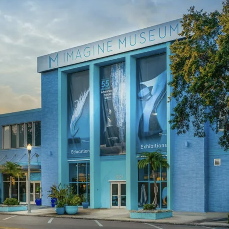 there is a blue building with a large sign on the side of it