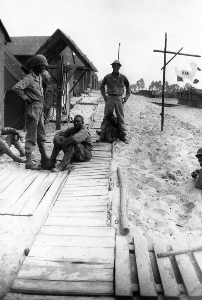 there are several soldiers that are standing on a wooden platform