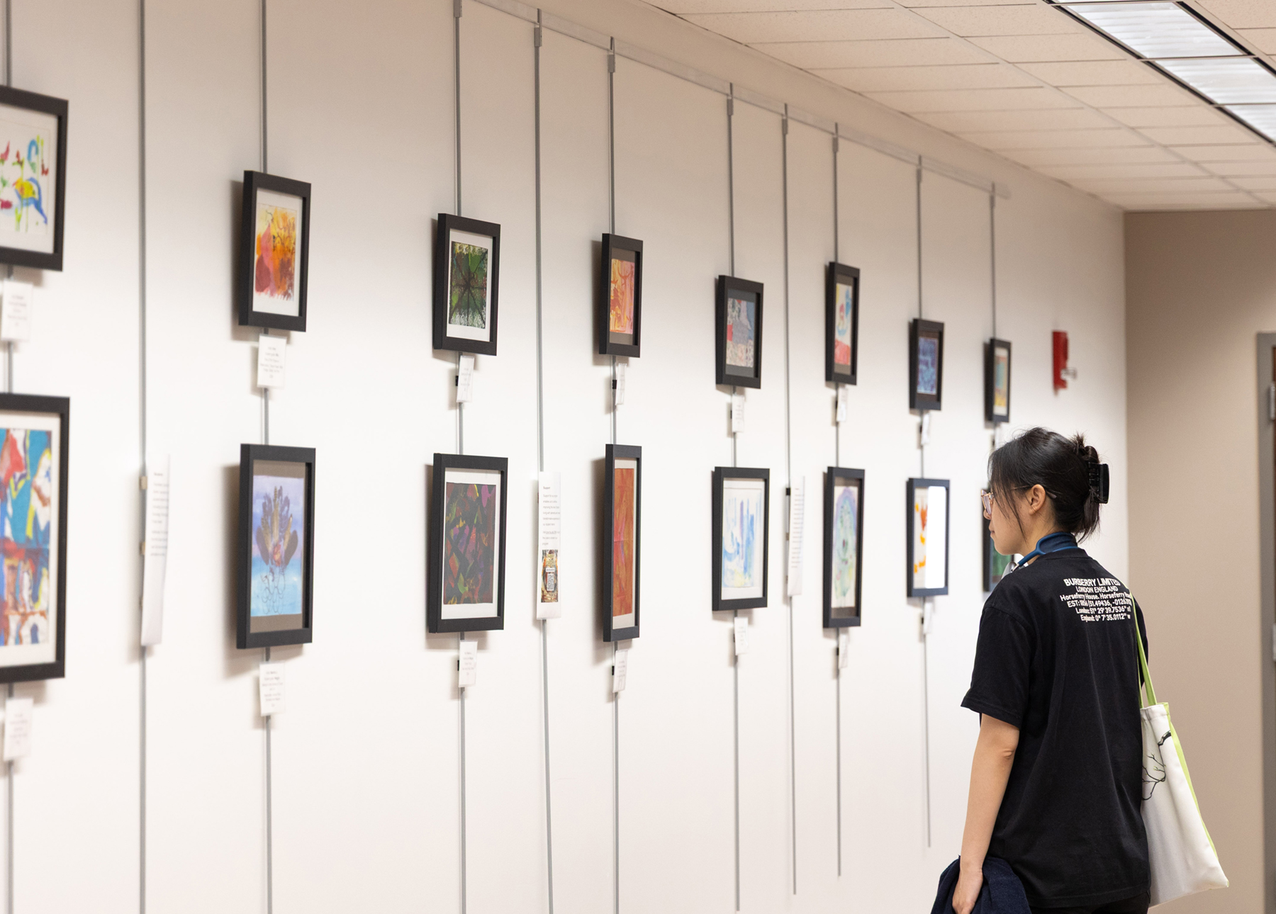 A person looking at art in a gallery